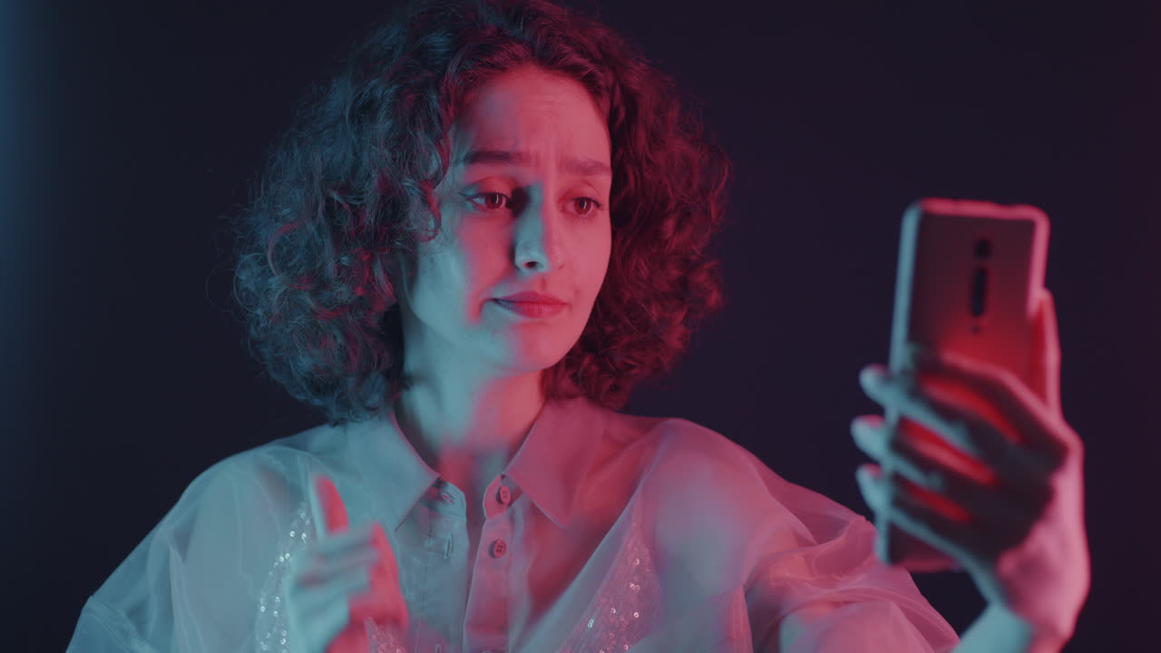 Woman Taking Selfie in Neon Light