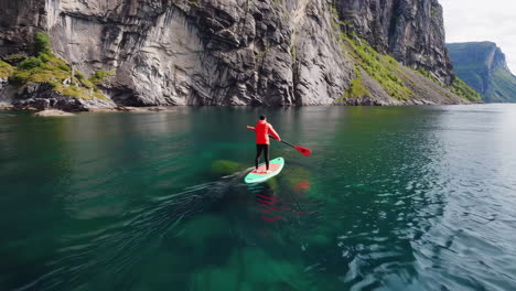 solo paddleboarding adventure in a scenic fjord