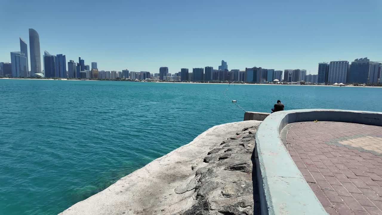 A clear view of Abu Dhabi’s modern skyline on a radiant sunny day in the UAE