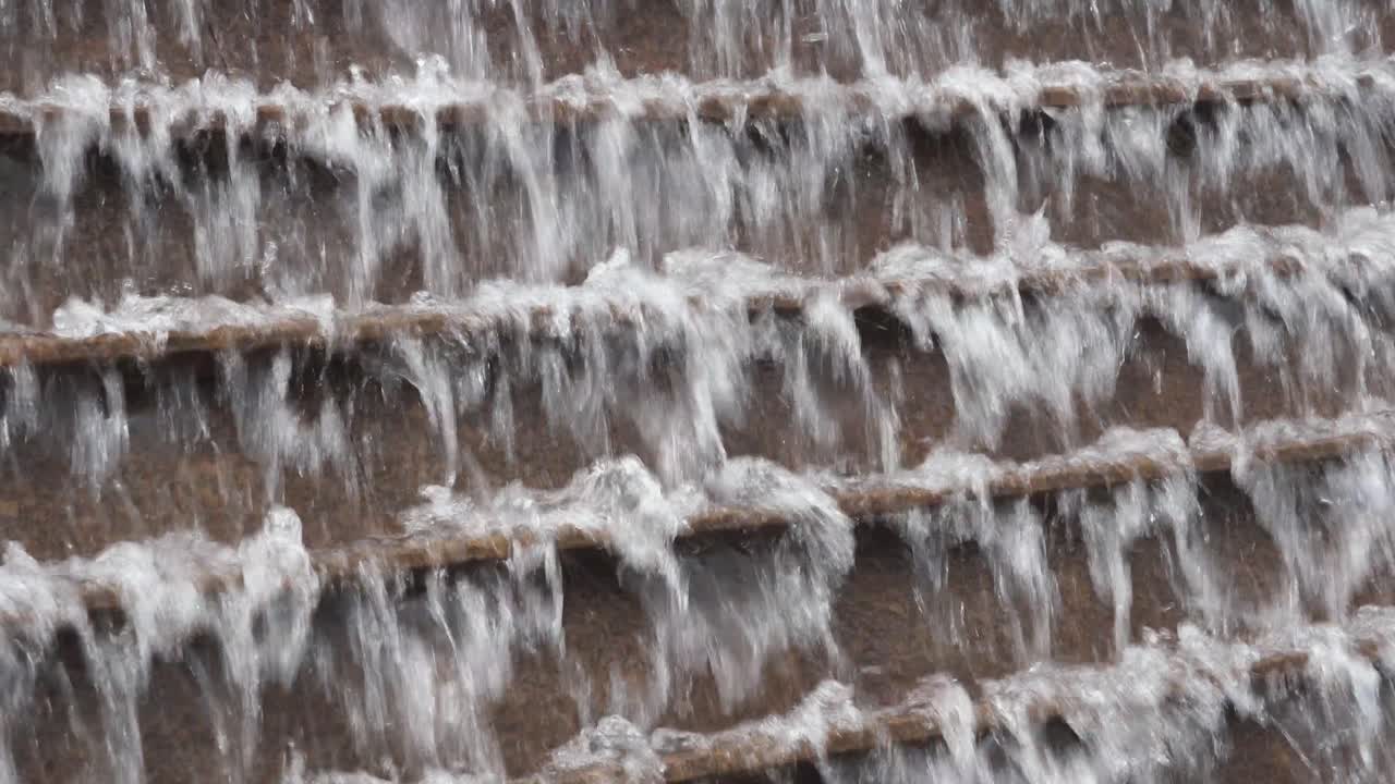 A decorative water small-size waterfall is seen at a garden in Central district, Hong Kong.