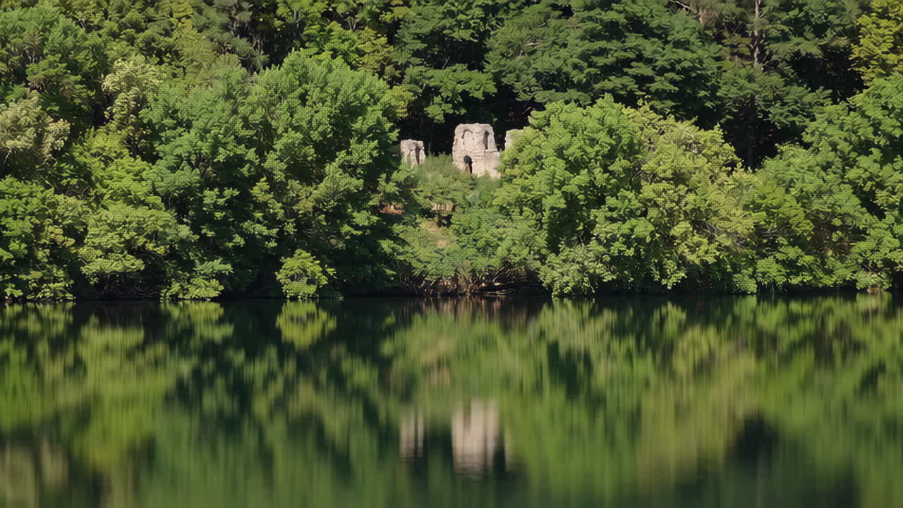 Reflections of Ruins on a Calm Lake