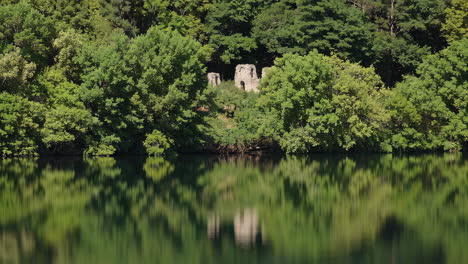 reflections of ruins on a calm lake