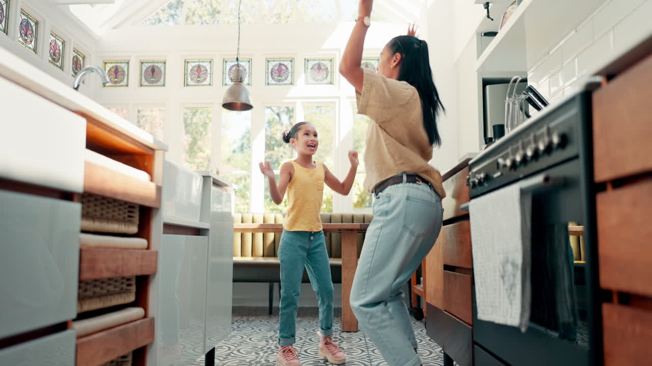 Freedom, kitchen and mom dancing with her daughter