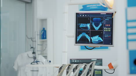 close up of medical stomatology display with teeth x ray images on it