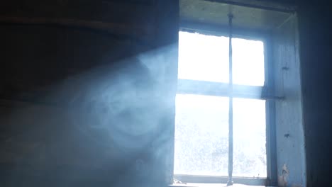 smoke in a ray. light falling from a window.