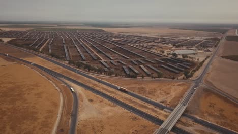 aerial: slow push in on huge cow farm, feedlot