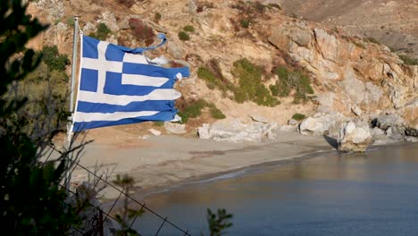 tattered greek flag blowing in the wind slow motion