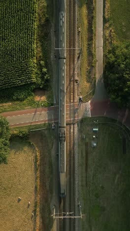 aerial view of train crossing at railway crossing