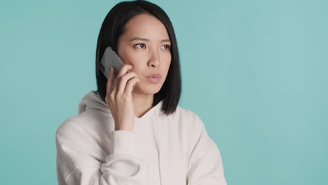 asian woman having a phone call on smartphone.