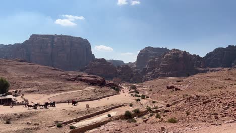 petra valley in wadi musa, jordan with the treasury in the middle of a rocky and mountainous landscape, an unesco heritage site, ancient nabatean kingdom 4k establish shot