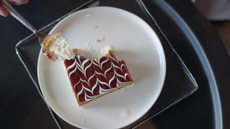 close-up of a delicious dessert with a spoon taking a bite