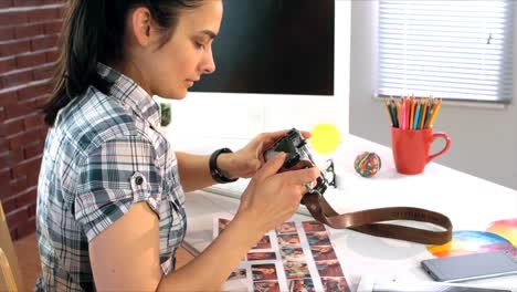 business executive checking photos in camera