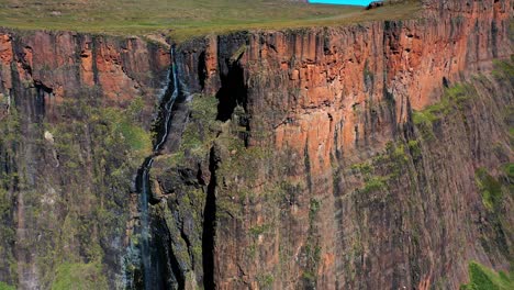 Backwards aerial view steep waterfall, Tugela Falls, South Africa