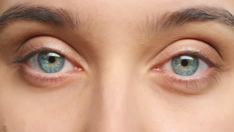 blue eye of woman with sight to blink