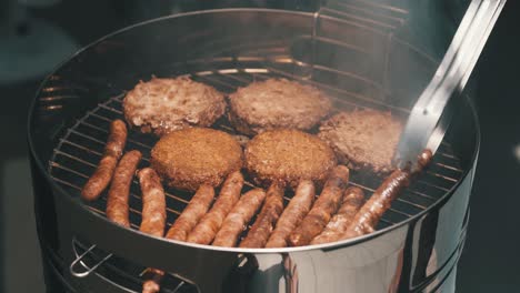 Cooking-burgers-and-sausages-outdoors