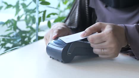 paying with a credit card at a restaurant