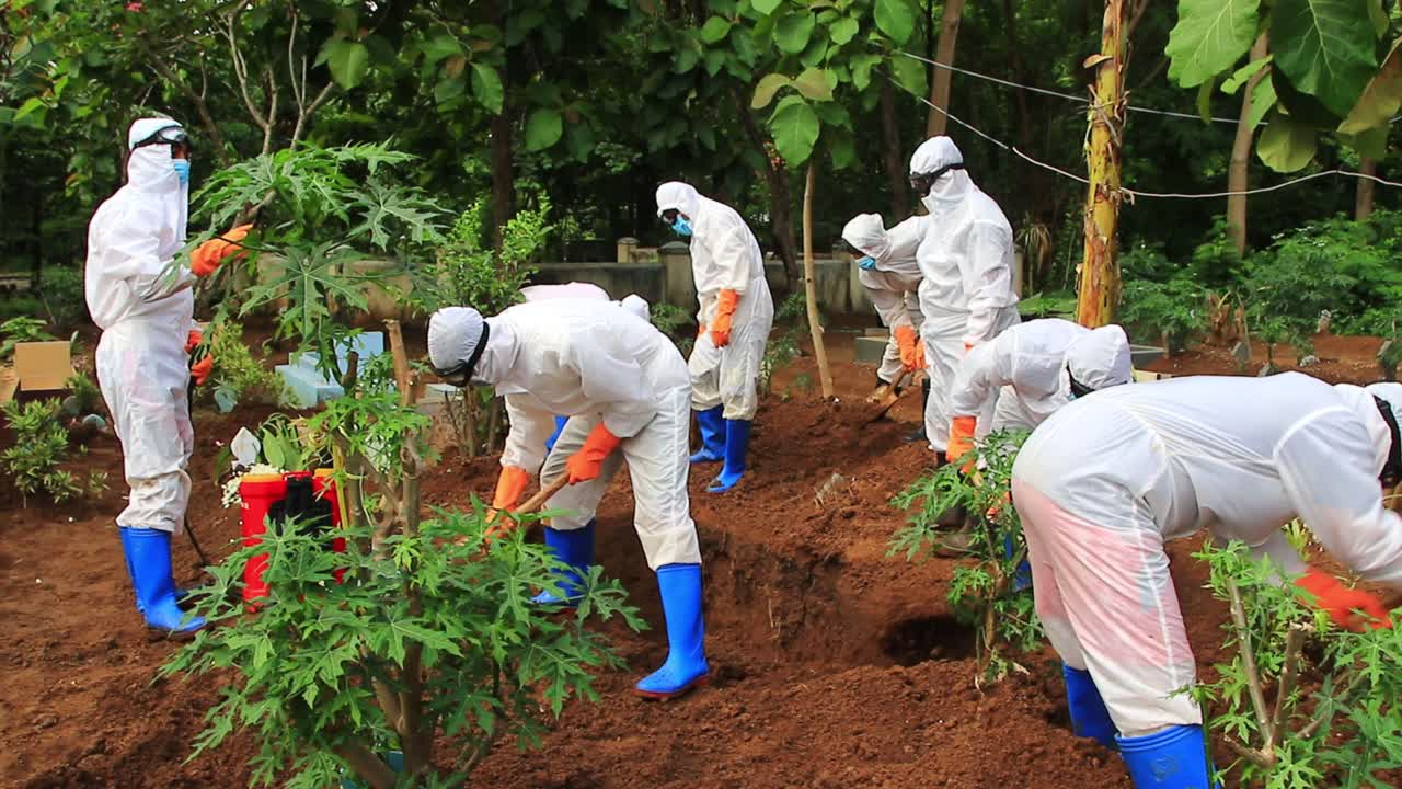 The funeral process of a corpse infected with the corona virus with the Covid-19 protocol. (The funeral of a Covid-19 patient), Not Focus Image and Noise, Pekalongan