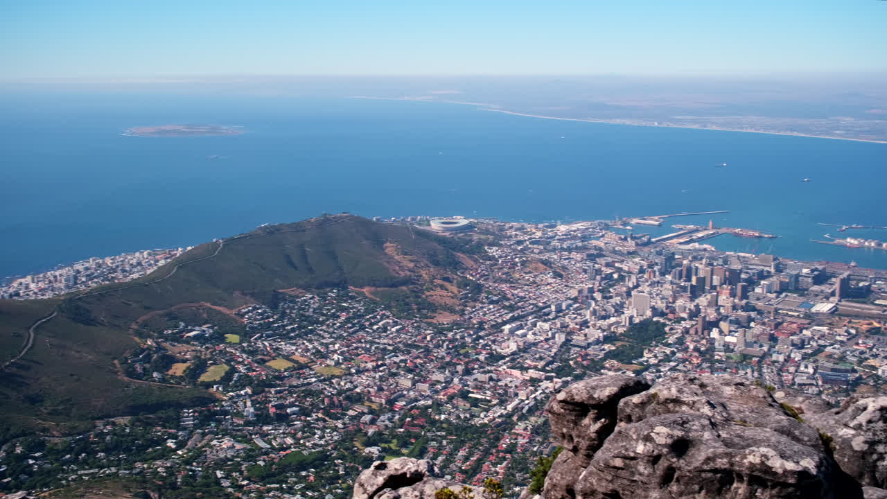 Wide sweeping view from Table Mountain over Cape Town showing iconic landmarks