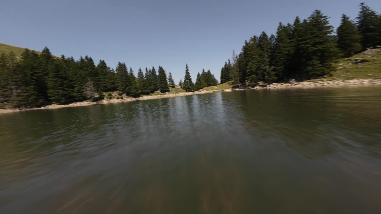 Swiss outdoor mountain nature at the Gantrischhütte, lake, grasslands, FPV drone video, hiking and adventure