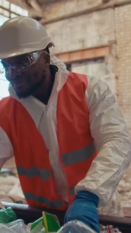worker in protective gear handling waste