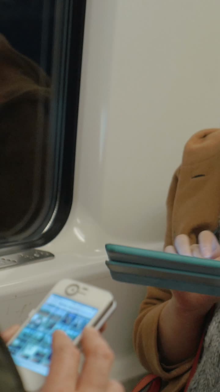 Person using a tablet on a train