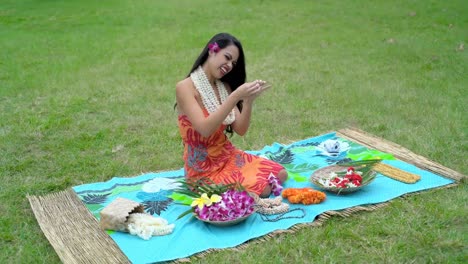 young woman preparing garland in the garden 4k