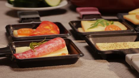 Italian or Spanish restaurant with traditional tapas food, Spanish cuisine, delicious tapas and cheese plate, bruschetta with cheese, olives dry tomatoes and tasty sandwich bar appetizer, buffet
