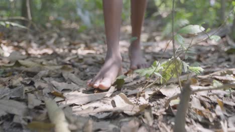 a boy foot steps in forest