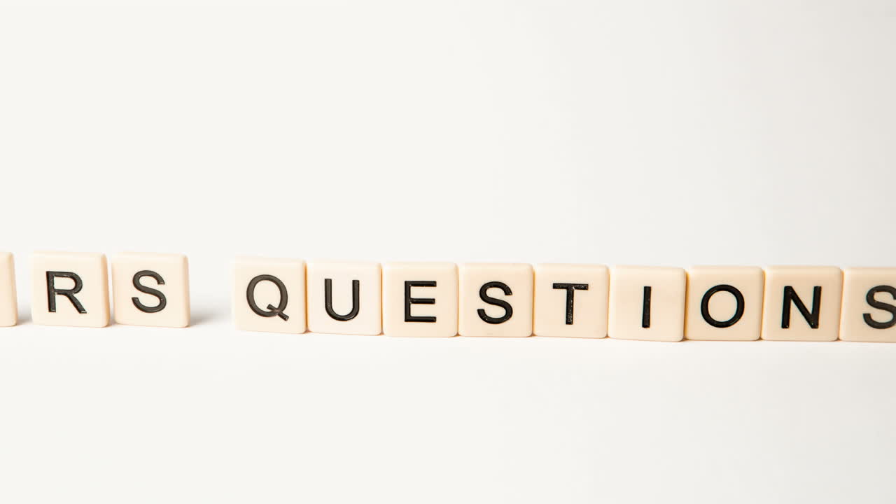 Letter pieces spelling questions and answers standing up and moving over