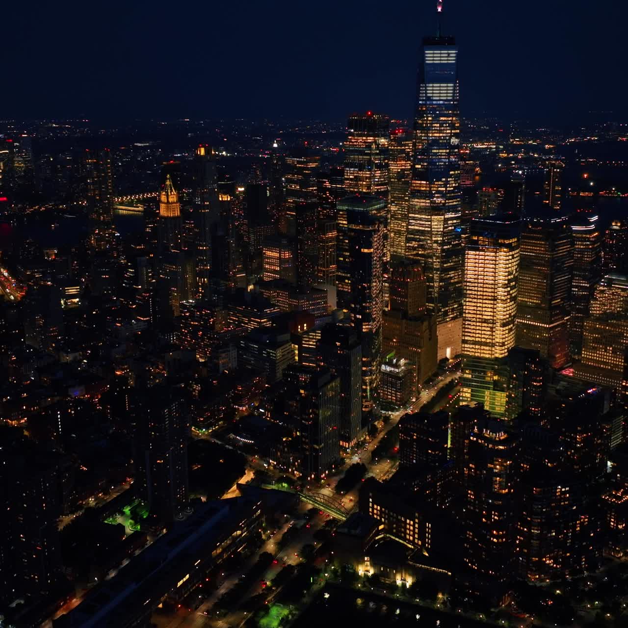 Impressive night scenery of New York. Drone descending above the vibrant city