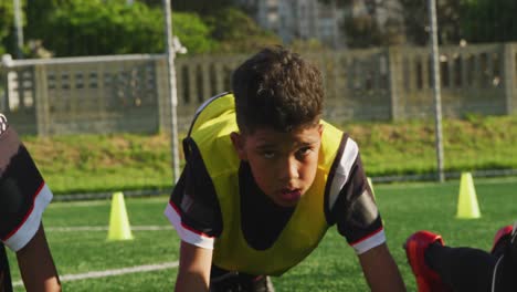 soccer kids exercising in a sunny day