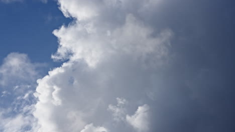 cumulus clouds expanding dynamically against a blue sky in a captivating timelapse