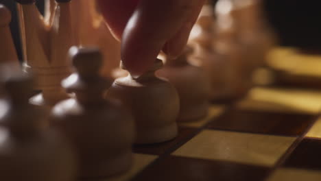 close-up of wooden chess pieces on a chessboard