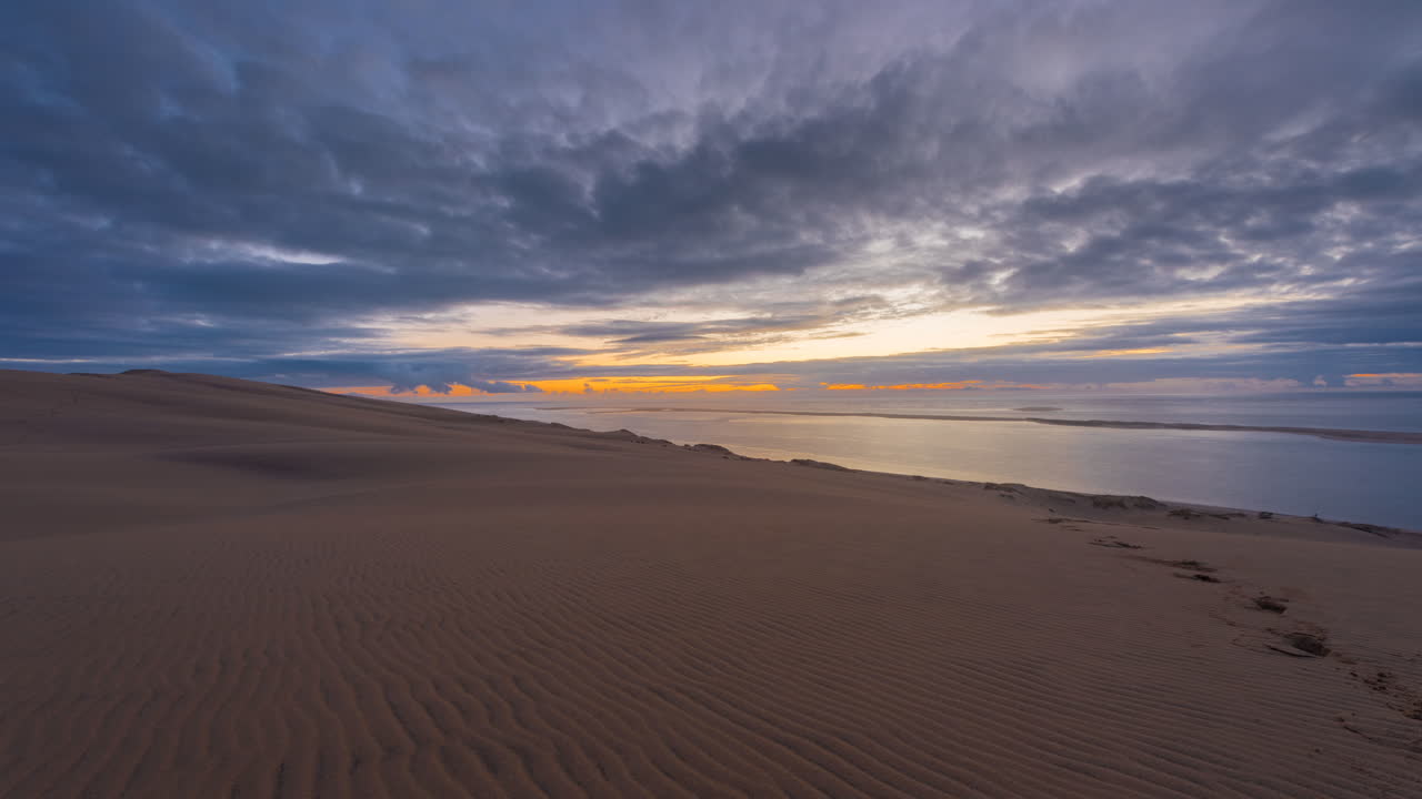 Sunset over Sand Dunes and Ocean