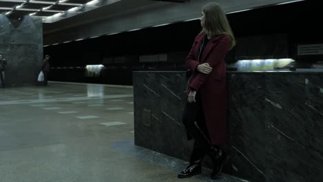 woman waiting in a subway station