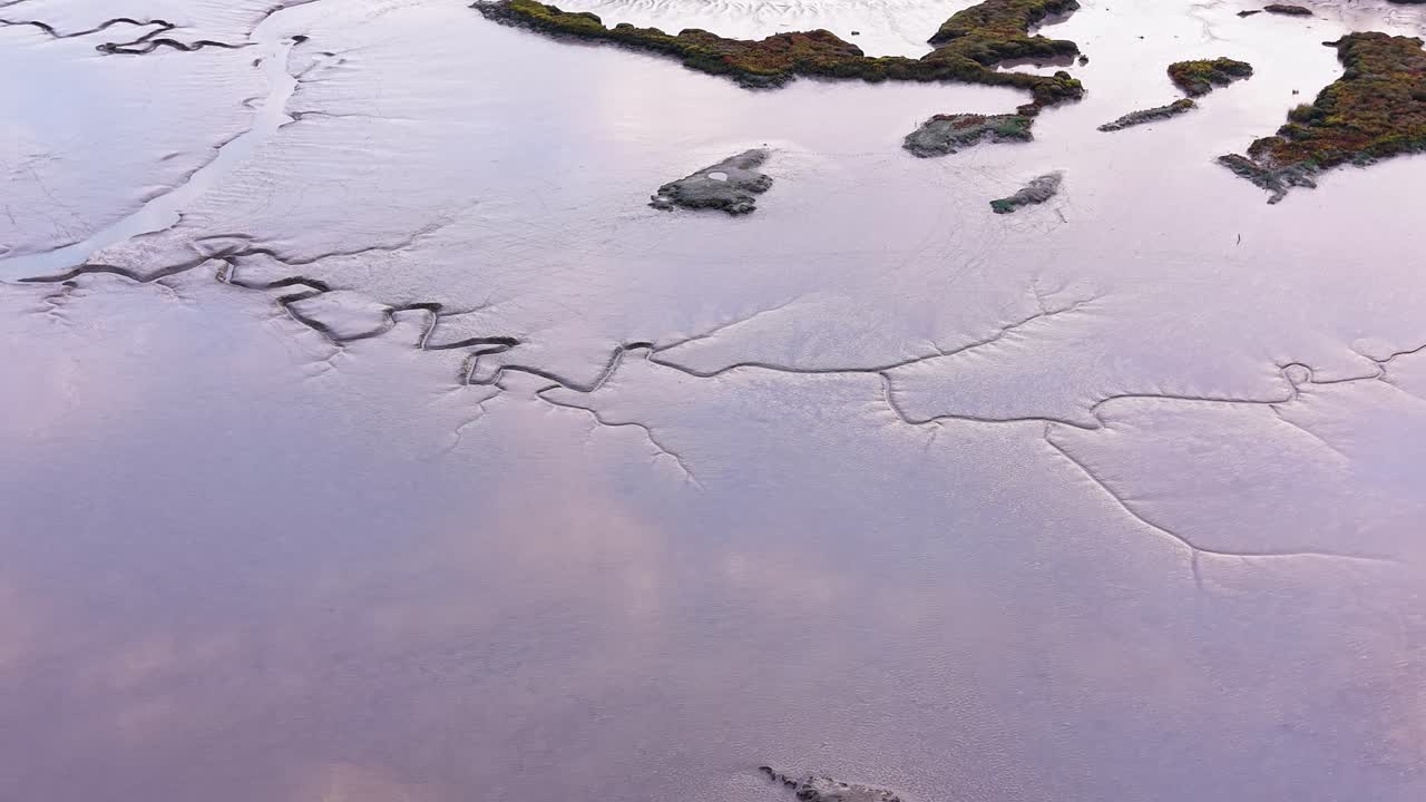 Aerial view looking down at Maldon saltmarsh thunderbolt texture in Essex low tide tidal mud flats
