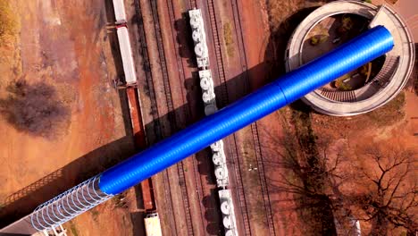 top down pov - lobatse train station smooth establishing 4k drone shot at day time