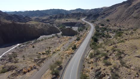 aerial view of truck driving along highway n-25 in baluchistan