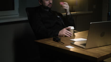 man eating and drinking on his break