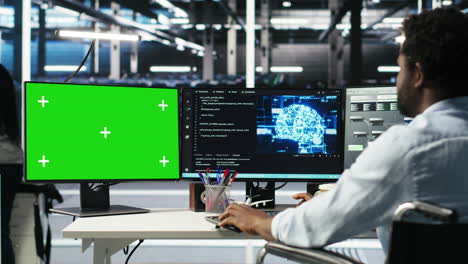 data center engineer with paraplegia using ai algorithms on green screen pc