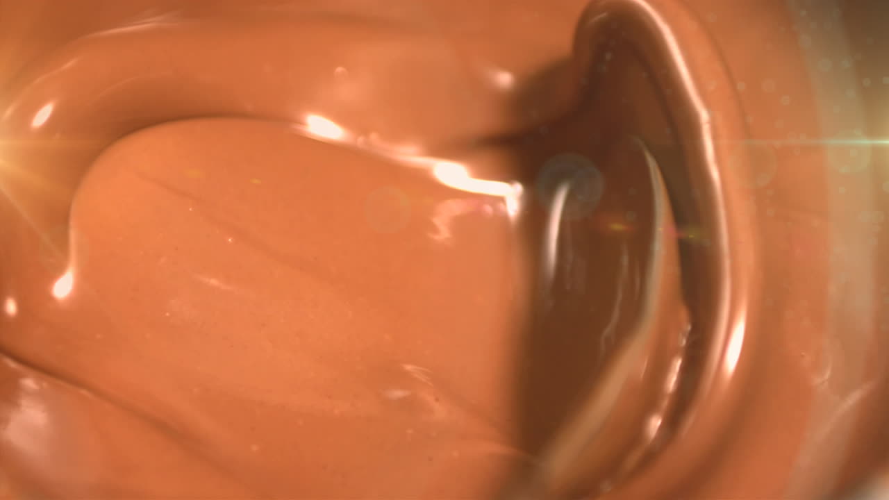 animación de la luz sobre el chocolate con leche fundido