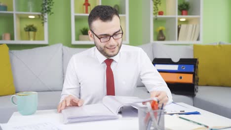 businessman working at home in a fun and happy mood.