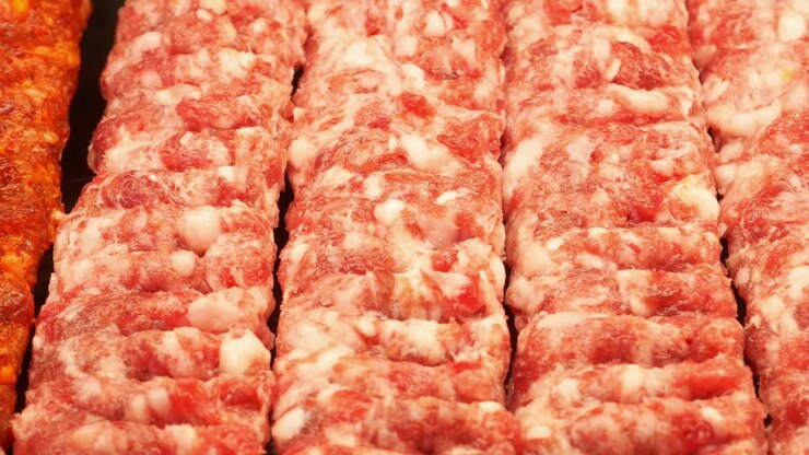 Rows of Raw Ground Meat Prepared for Kebabs