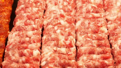 Rows of Raw Ground Meat Prepared for Kebabs