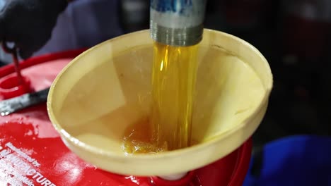 close up shot lubricant oil spill the filtering process, industry 5.0