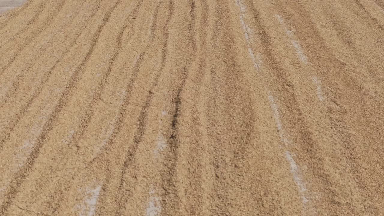Drone View of Rice Drying on a Road in the Philippines