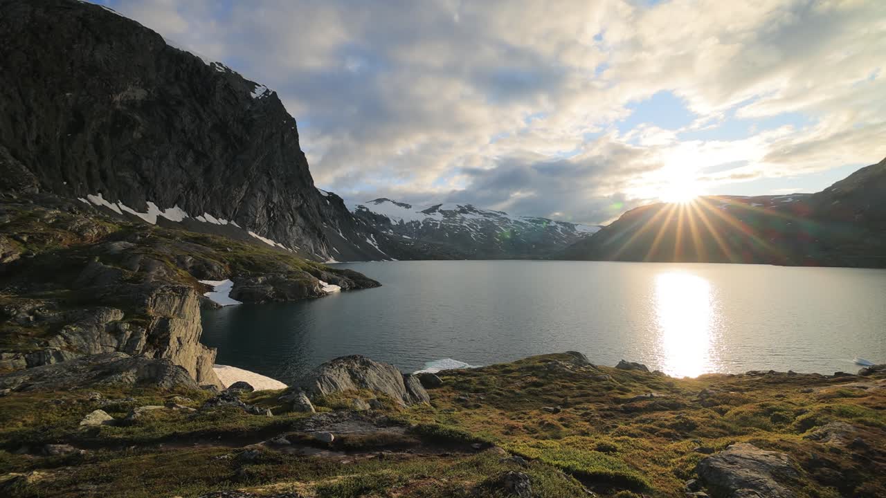 Sunset against the backdrop of the Norwegian mountains. Beautiful Nature Norway natural landscape.