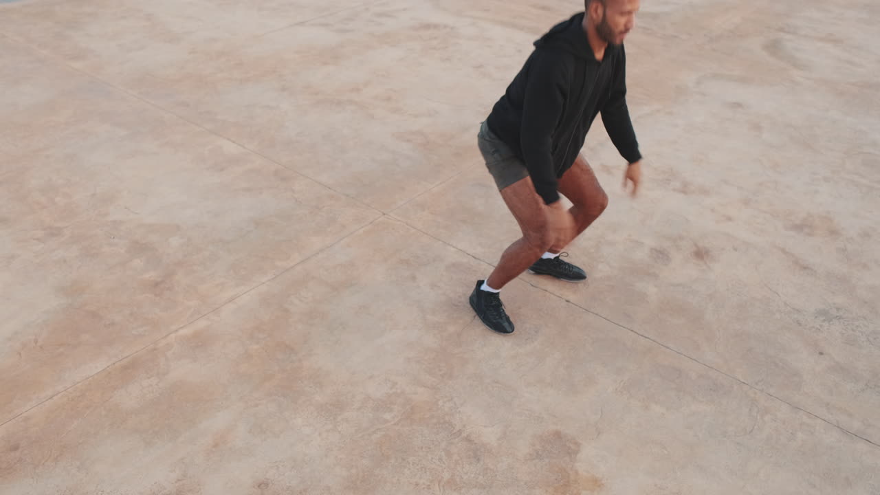 Man doing squats outdoors