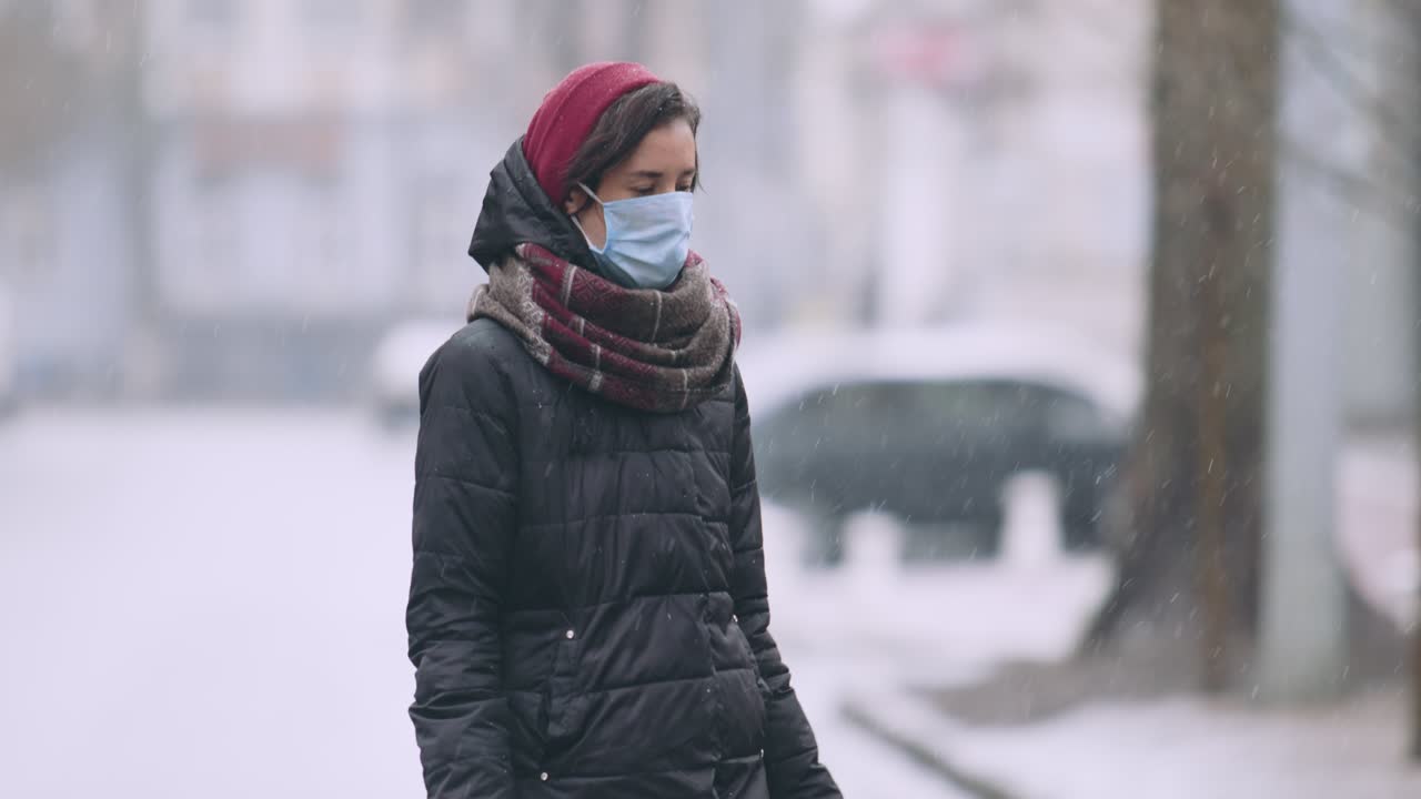 Woman wearing mask in snow