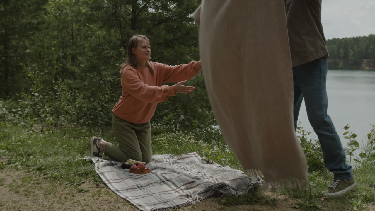 People having a picnic by the lake